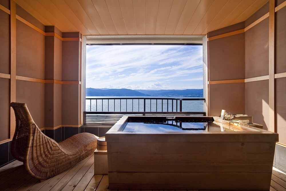 Enjoy the relaxing time with an in-room hot spring as you gaze out on views of Suwa Lake.1